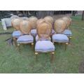 A Set of Eight (8) Gilded French Rattan Ornately Carved Balloon-Back Chairs