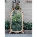 A 19th Century Rococo Style Ornately Carved Gilt Wood Mirror