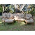 A 20th Century French Louis XVI Style Set of a Carved and Gilded Settee and Four Armchairs with T...