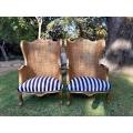 A Pair of 20th Century French Style Gilt Wood Arm Chairs with Rattan Back