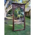A French Style Ornately Carved and Gilded Bevelled Mirror of Large Proportions