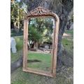 A French Rococo Style Ornately Carved & Gilded Bevelled Mirror