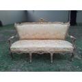 A 20th Century Circa 1950 French Style Ornately Carved Giltwood Settee