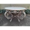A 20th Century French Style Wrought Iron Circular Table with Cream Top