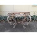 A 20th Century French Style Wrought Iron Circular Table with Cream Top