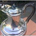 Silver plated tea kettle on stand