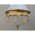 A 20th Century Empire Style Brass and Crystal Chandelier