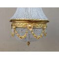 A 20th Century Empire Style Brass and Crystal Chandelier