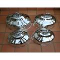 A Set Of Four Silver-Plate Food Domes