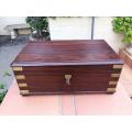 A Mahogany Polished Box With Brass details and Escutcheon and Key