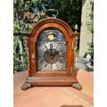 A 20th Century Walnut Clock with Metal and Brass Mounts and Mechanism and Ke