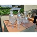 A Crystal and Glass Collection of Decanters with Silver Hallmarked Labels Whiskey, Brandy and Gin...