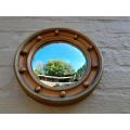 An early 20th Century Circa 1920 Regency Style Giltwood Mirror with Convex Frame