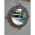 An Early 20th Century Circa 1920 Ornately Carved Giltwood Convex Mirror