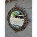 An Early 20th Century Circa 1920 Ornately Carved Giltwood Convex Mirror