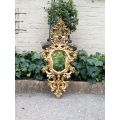 A 20th Century French Style Ornately Carved and Gilt Painted Wooden Mirror