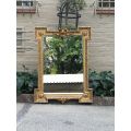 A Highly Carved and Ornate French-style Gilt and Bevelled Mirror