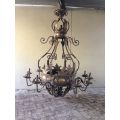 A Large Wrought Iron and Hand-Painted Imported Chandelier with Crown Detail