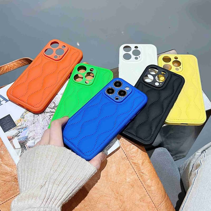 For iPhone 15 Fine Hole 8-shaped Texture Eiderdown Airbag Phone Case(Orange)