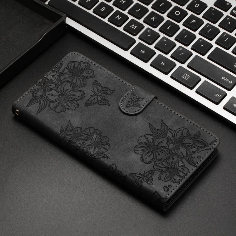 For Samsung Galaxy S23 5G Cherry Blossom Butterfly Skin Feel Embossed PU Phone Case(Black)