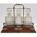 Vintage Oak Tantalus with 3 Cut Glass Decanters, incl key - 2 decanters has some chips as per photo