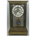 Antique French mantel clock with brass and glass casing - some damage to face and glass - no bell