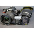Nikon D3100 14.2MP DSLR Camera with Nikkor 18-135mm F3.5-5.6G IF-ED Lens and 2 Batteries