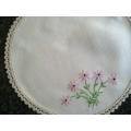 Pretty hand embroidered linen doilie 24cm