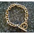 Gold metal link bracelet with toggle