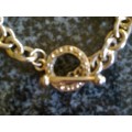 Gold metal link bracelet with toggle