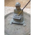 vintage brass buddha incense burner on brass plate