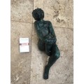 bronze sculpture figure of nude woman laying on back
