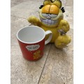 vintage Garfield coffee mug and garfield suction doll