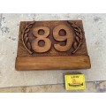 No 89 , no 68 wood carved no plaque