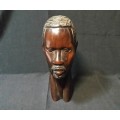 A SOLID WOODEN CARVED SCULPTURE