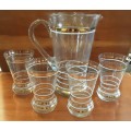 Glass Pitcher Jug and four glasses with gold pattern