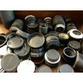 A Job lot of Camera Lenses , covers and parts sold as is