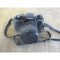 Popular Vintage Minolta X-300s SLR Camera With Film And Attached Minolta MD Zoom 28 - 70 mm Lens