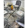 Giselle dinning set 4 chairs and a round glass table