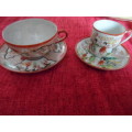 Two beautiful cups and saucers  very thin china made in japan