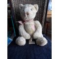 Beautiful vintage Russ bear with checkered heart and bow.  Sitting and quite large