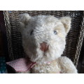 Beautiful vintage Russ bear with checkered heart and bow.  Sitting and quite large