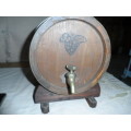 Very large oak wine barrel for a pub on a stand.    26.5 long 20cm diameter  brass tap and bands