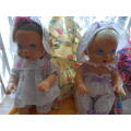 Two cuchiecoo dolls with original outfits plus 1 extra each and two bottles and 1 dummy