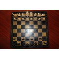 ANTIQUE CHINESE HANDCARVED and STAINED BONE CHESS SET WITH LACQUERED WOODEN BOARD/CASE 34 BY 35 CM