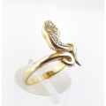 Yellow gold snake ring set with pavé diamonds