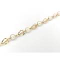 Pretty 14ct gold heart shaped link pearl bracelet