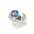 Elegant blue topaz and sterling silver ring