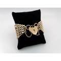 Stunning gate link 9ct gold bracelet with heart locket