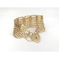 Stunning gate link 9ct gold bracelet with heart locket